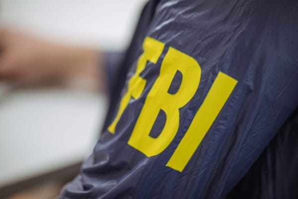Sleeve of an FBI jacket on agent
